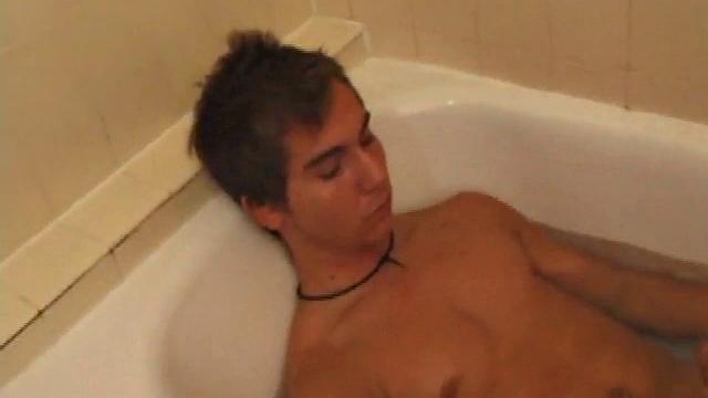 Brock is spending some down time in the bathtub reading a magazine and stroking his cock. After edging himself a few times, it doesn't take long to spew a warm load of cum onto his face.