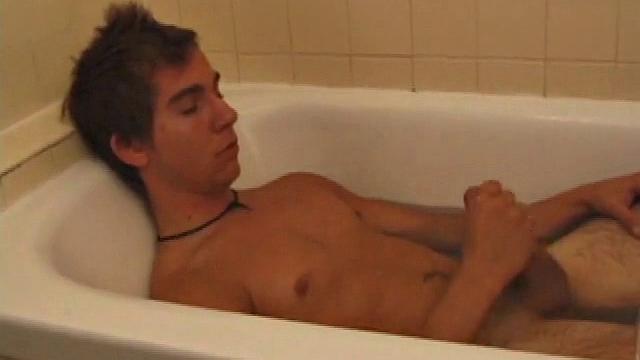 Brock is spending some down time in the bathtub reading a magazine and stroking his cock. After edging himself a few times, it doesn't take long to spew a warm load of cum onto his face.