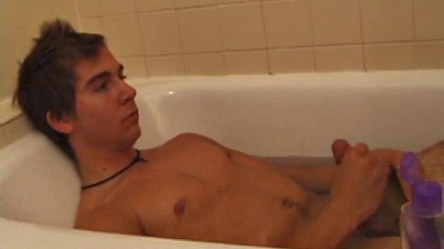 Brock is spending some down time in the bathtub reading a magazine and stroking his cock. After edging himself a few times, it doesn't take long to spew a warm load of cum onto his face.