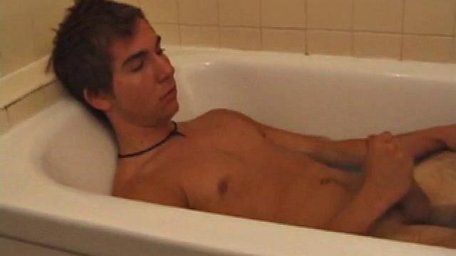 Brock is spending some down time in the bathtub reading a magazine and stroking his cock. After edging himself a few times, it doesn't take long to spew a warm load of cum onto his face.
