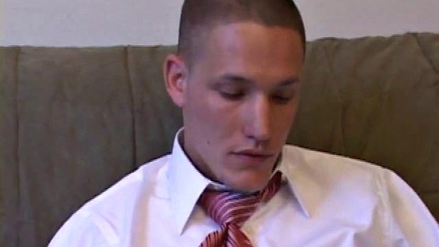 Jay unzips pants, pulls out raging boner and strokes to porn video. After stripping off shirt and tie, Jay works dick as he talks to camera. In no time he explodes a killer cum gusher on his face and chest.