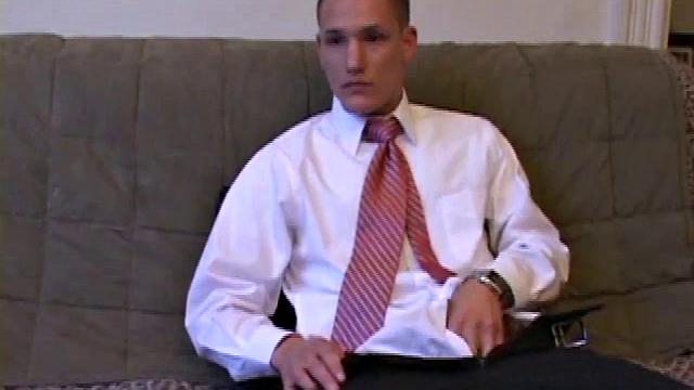 Jay unzips pants, pulls out raging boner and strokes to porn video. After stripping off shirt and tie, Jay works dick as he talks to camera. In no time he explodes a killer cum gusher on his face and chest.