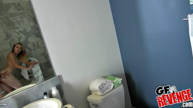 Blonde parker gives a sloppy bathroom handjob and gets a hot facial