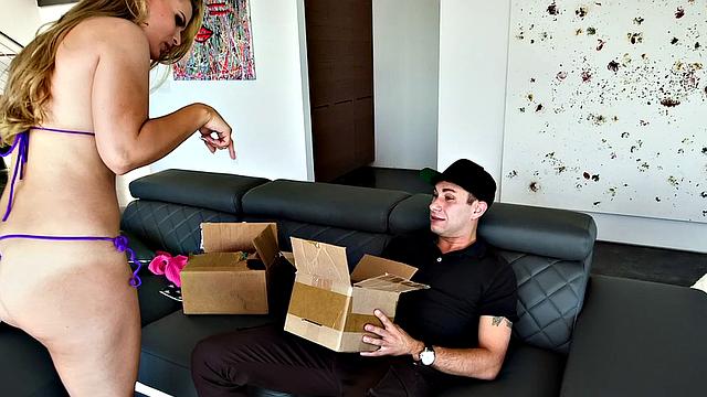 Blonde amateur gets her trimmed pussy pounded on the couch while getting a special delivery