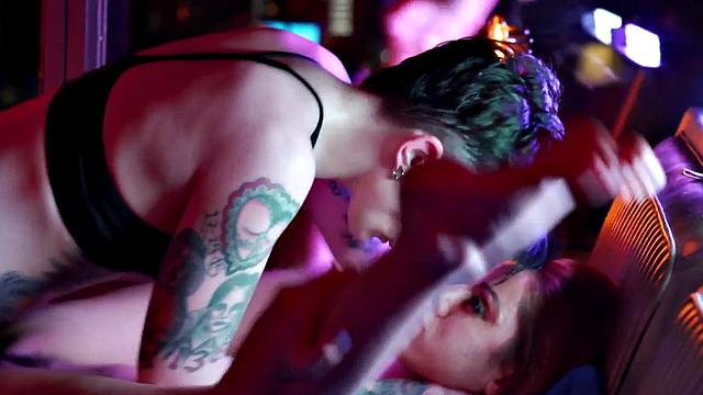 A tattooed brunette get her pussy licked & strap-on drilled by her lesbian lover