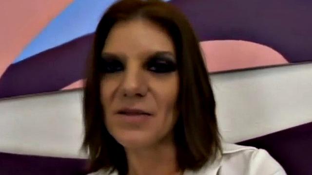 Brunette in white gets her tattooed pussy drilled by a big black cock