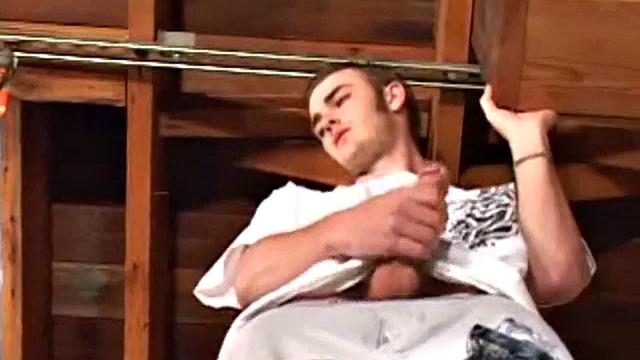 Christian Wilde whips out his huge cock as he watches porn. He's dead serious about busting a nut and quickly gets himself stiff. After stroking with determination, globs of cum drop to the floor.