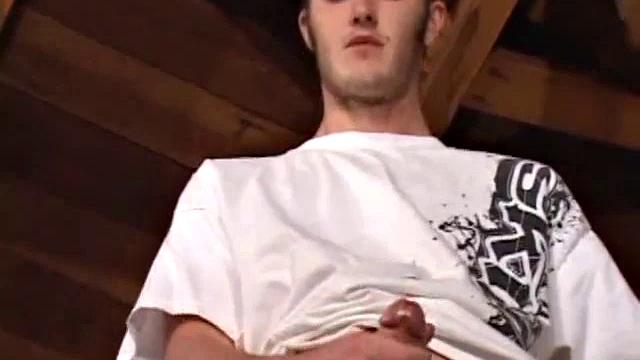 Christian Wilde whips out his huge cock as he watches porn. He's dead serious about busting a nut and quickly gets himself stiff. After stroking with determination, globs of cum drop to the floor.