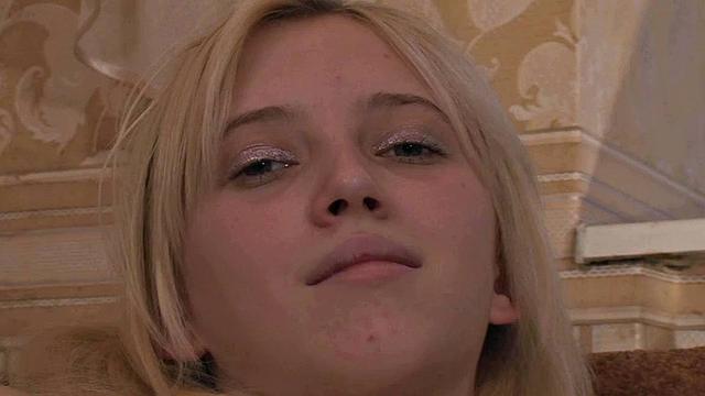 Slim blonde in the kitchen