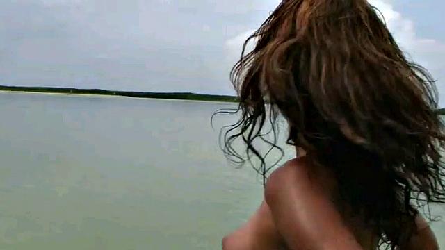 Check out this stunning Latina with small tits getting naked on the beach in a thong and piercing