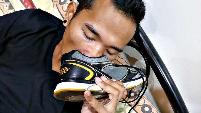 Joshua is a kinky Asian boy who gets off on male feet. He just got home from a long day at work, and nothing turns him on more than the sweet aroma of his Asian boy feet that have spent all day penned up in his shoes.