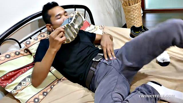 Joshua is a kinky Asian boy who gets off on male feet. He just got home from a long day at work, and nothing turns him on more than the sweet aroma of his Asian boy feet that have spent all day penned up in his shoes.
