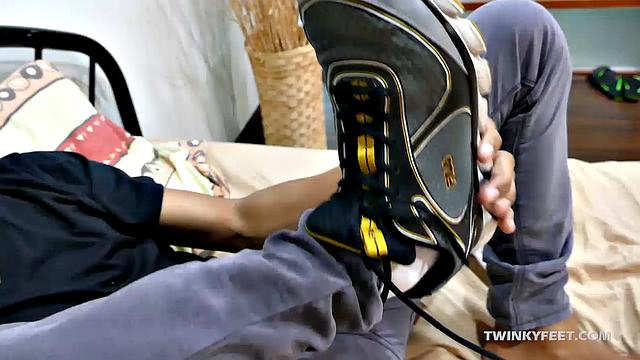 Joshua is a kinky Asian boy who gets off on male feet. He just got home from a long day at work, and nothing turns him on more than the sweet aroma of his Asian boy feet that have spent all day penned up in his shoes.