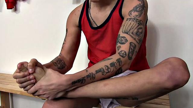 Sexy white twink Tom Uli arrives early in the locker room for the match and is feeling horny for some solo foot fetish action. He wants to have a good wank before the game.