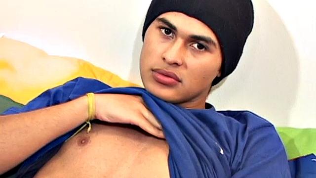 This cute and silky smooth Latin boy is packing a big one, which is obvious when he pushes his pants down. Alfredo pulls out that monster uncut cock and starts stroking.