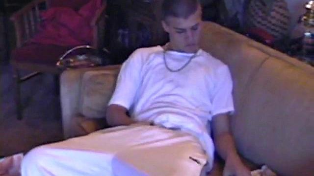 Lance starts out this solo scene sitting on the sofa with his sweats pushed down just below his balls. Lance talks to the camera a little, asking if we like his cock.