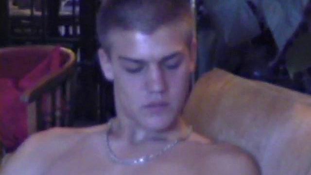 Lance starts out this solo scene sitting on the sofa with his sweats pushed down just below his balls. Lance talks to the camera a little, asking if we like his cock.