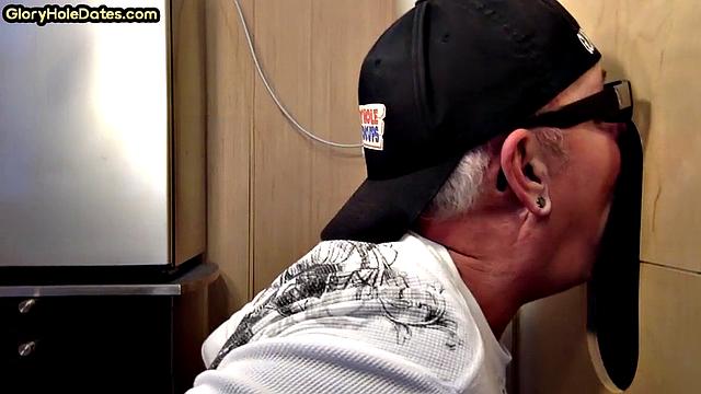 Gloryhole gay sucks big black cock while stroking