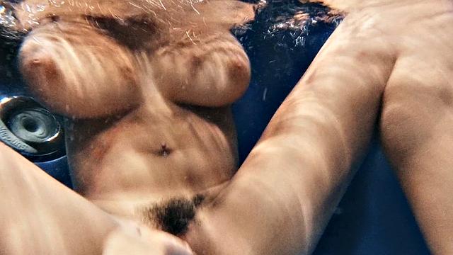 Latina lesbians enjoy fingering and licking each other's wet pussies in the pool