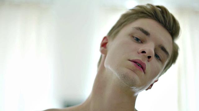 Young hunk toys his ass and tuggs on his shorts after showing off his body