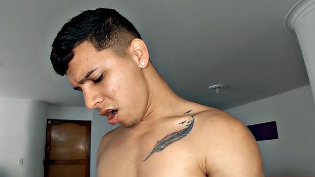 This buff Latin boy quickly strips naked and works up a boner. Titan is all over the room, standing and sitting, as he strokes his way to a climax.
