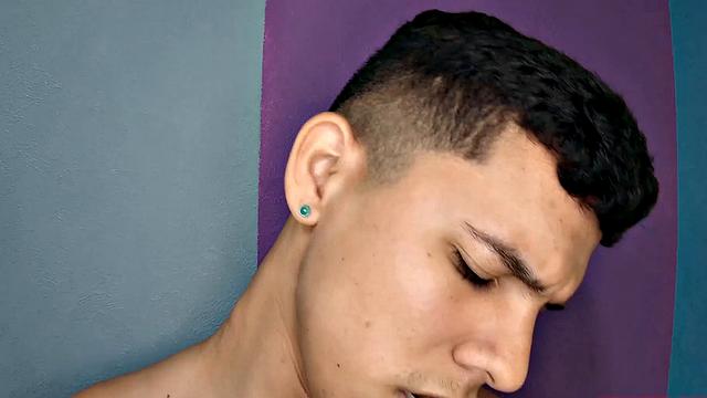 This buff Latin boy quickly strips naked and works up a boner. Titan is all over the room, standing and sitting, as he strokes his way to a climax.