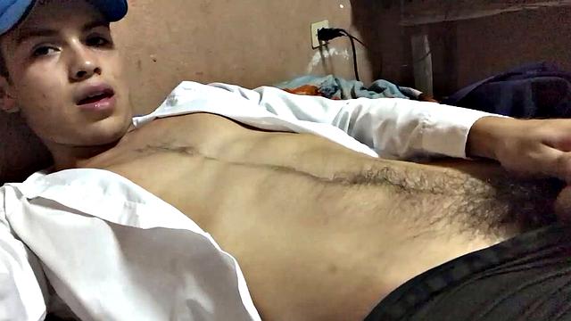 Our featured solo boy of the week is Latino Dantty Calderon. On his bed, he works up a stiff one and then lets his cock pop out of the waist band of his boxers.