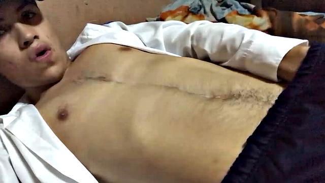 Our featured solo boy of the week is Latino Dantty Calderon. On his bed, he works up a stiff one and then lets his cock pop out of the waist band of his boxers.