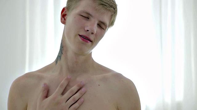 Handsome twink jerks and cums during solo session