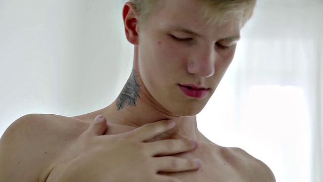 Handsome twink jerks and cums during solo session