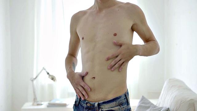 Handsome twink jerks and cums during solo session