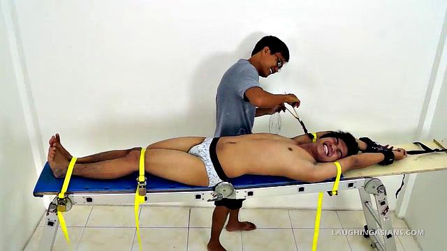 Oh so cute and ticklish Asian twink Ronny makes his debut appearance on Laughing Asians in the usual fashion. This 19 year old Asian boy is delightfully ticklish.