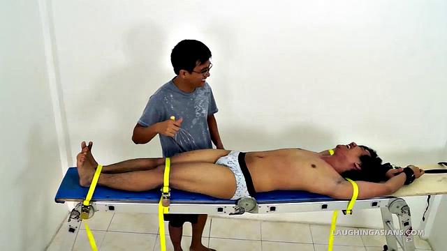 Oh so cute and ticklish Asian twink Ronny makes his debut appearance on Laughing Asians in the usual fashion. This 19 year old Asian boy is delightfully ticklish.