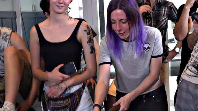 Public BDSM babe deepthroats hard cock in front of onlookers