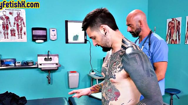 Tattooed jock fisted and fucked in 3some at the infirmary