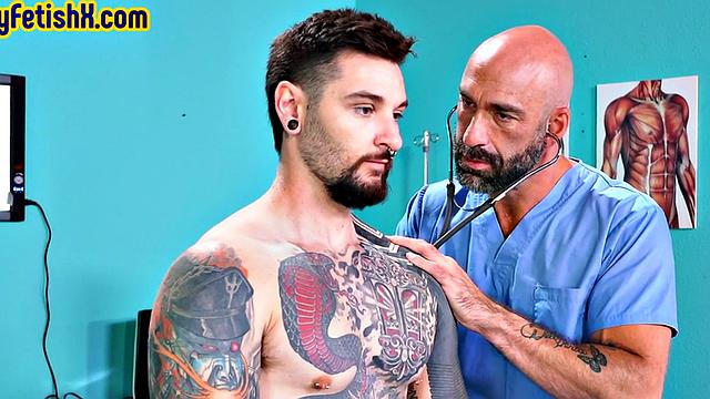 Tattooed jock fisted and fucked in 3some at the infirmary