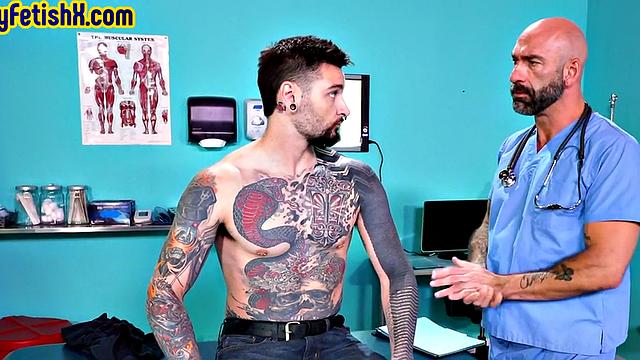 Tattooed jock fisted and fucked in 3some at the infirmary