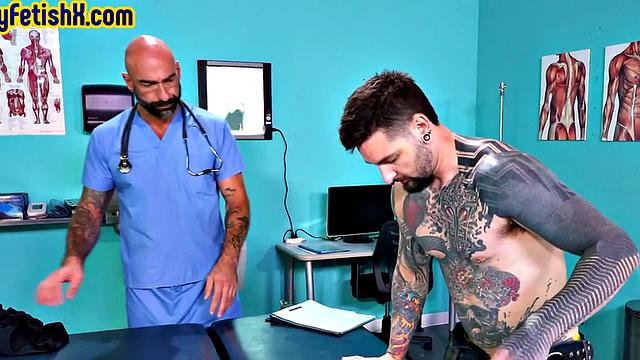 Tattooed jock fisted and fucked in 3some at the infirmary