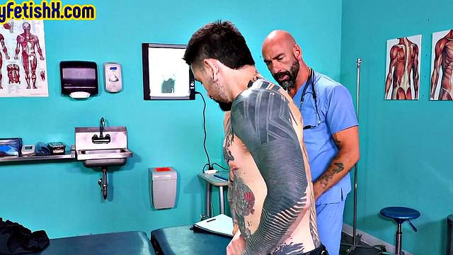 Tattooed jock fisted and fucked in 3some at the infirmary