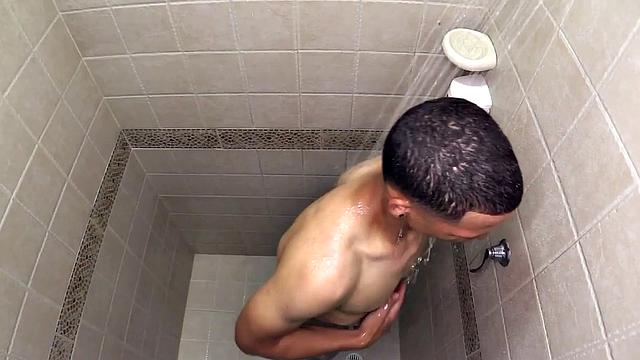 Macho is a smooth Latin boy, already naked, taking a shower. He starts playing with his big dick and in no time he's sporting a boner. He sits on the shower floor and a long stroke show follows.
