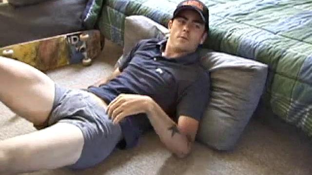 Dan gets down on the floor and starts watching a porn video. He goes right for his cock and plays with himself until he's boned up. Rolling the head with his palm, Dan lubes up his hot dick.