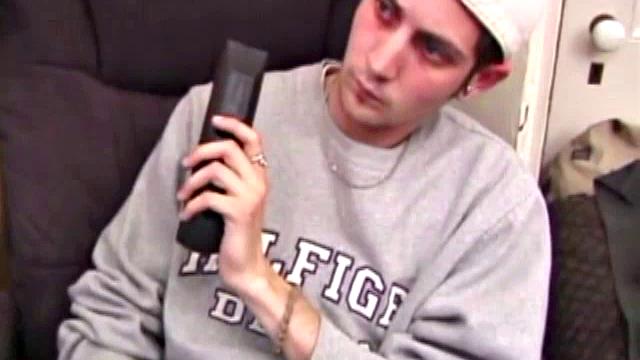 As a porn flick plays, young amateur Aaron Michaels strokes hard, pulls his cock out of his jeans, lets loose, and spills his nut on the bed.