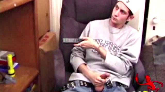 As a porn flick plays, young amateur Aaron Michaels strokes hard, pulls his cock out of his jeans, lets loose, and spills his nut on the bed.