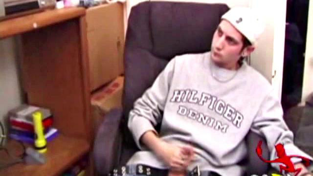 As a porn flick plays, young amateur Aaron Michaels strokes hard, pulls his cock out of his jeans, lets loose, and spills his nut on the bed.
