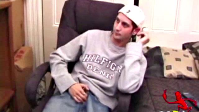 As a porn flick plays, young amateur Aaron Michaels strokes hard, pulls his cock out of his jeans, lets loose, and spills his nut on the bed.