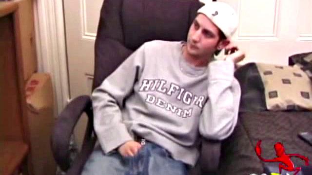 As a porn flick plays, young amateur Aaron Michaels strokes hard, pulls his cock out of his jeans, lets loose, and spills his nut on the bed.