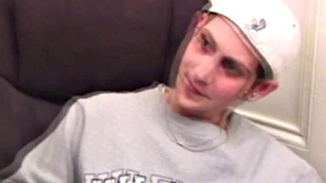 As a porn flick plays, young amateur Aaron Michaels strokes hard, pulls his cock out of his jeans, lets loose, and spills his nut on the bed.