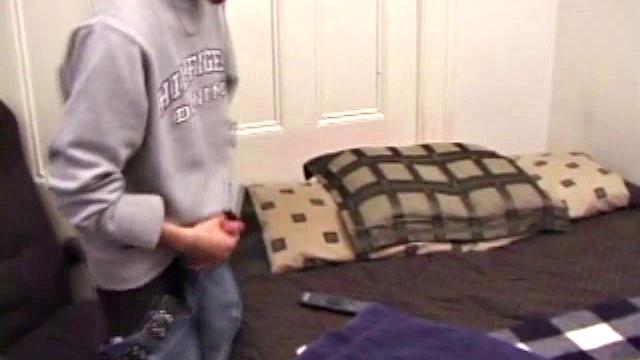 As a porn flick plays, young amateur Aaron Michaels strokes hard, pulls his cock out of his jeans, lets loose, and spills his nut on the bed.