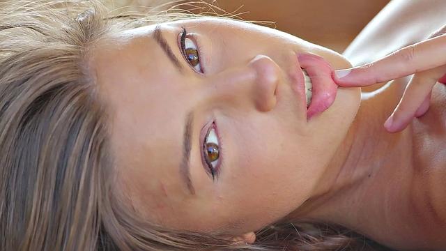 Watch this kinky solo babe with brown hair finger her bald pussy up close and personal