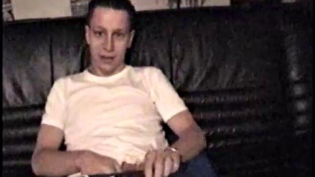 Kicking back on the sofa, Dominic mugs a bit for the camera, as he flips through some porn magazines for inspiration. He's pretty chatty, but gets quieter as he admires his hardening cock and strokes it.